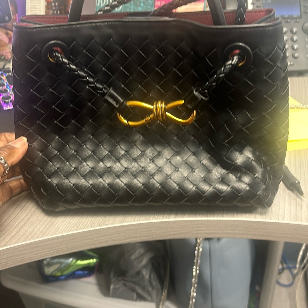 Black woven handbag